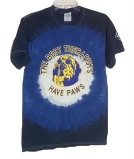 Tie-dye t-shirt with "The Best Therapists Have Paws" and a dog graphic, featuring a blue and black bulls-eye design.