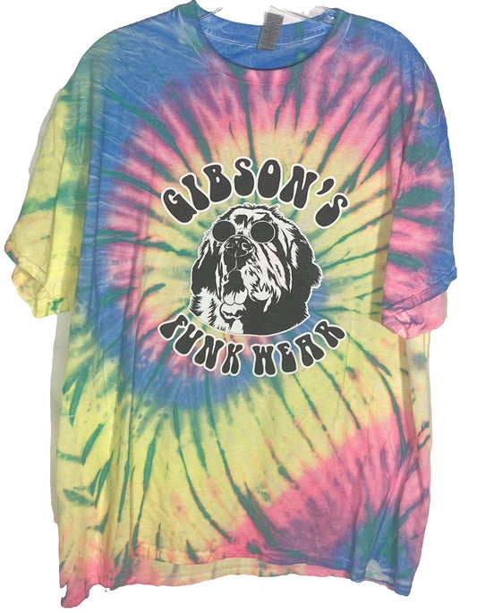 Multi-colored tie-dye T-shirt with "Gibson's Funk Wear" logo featuring an illustrated black and white dog wearing sunglasses.